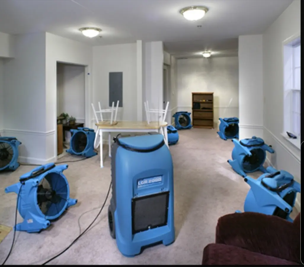 Air movers and dehumidifier setup for Water Damage Restoration in Silvis